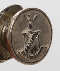A Continental Silvered Metal Figural Seal, Height 3 1/4 inches.
