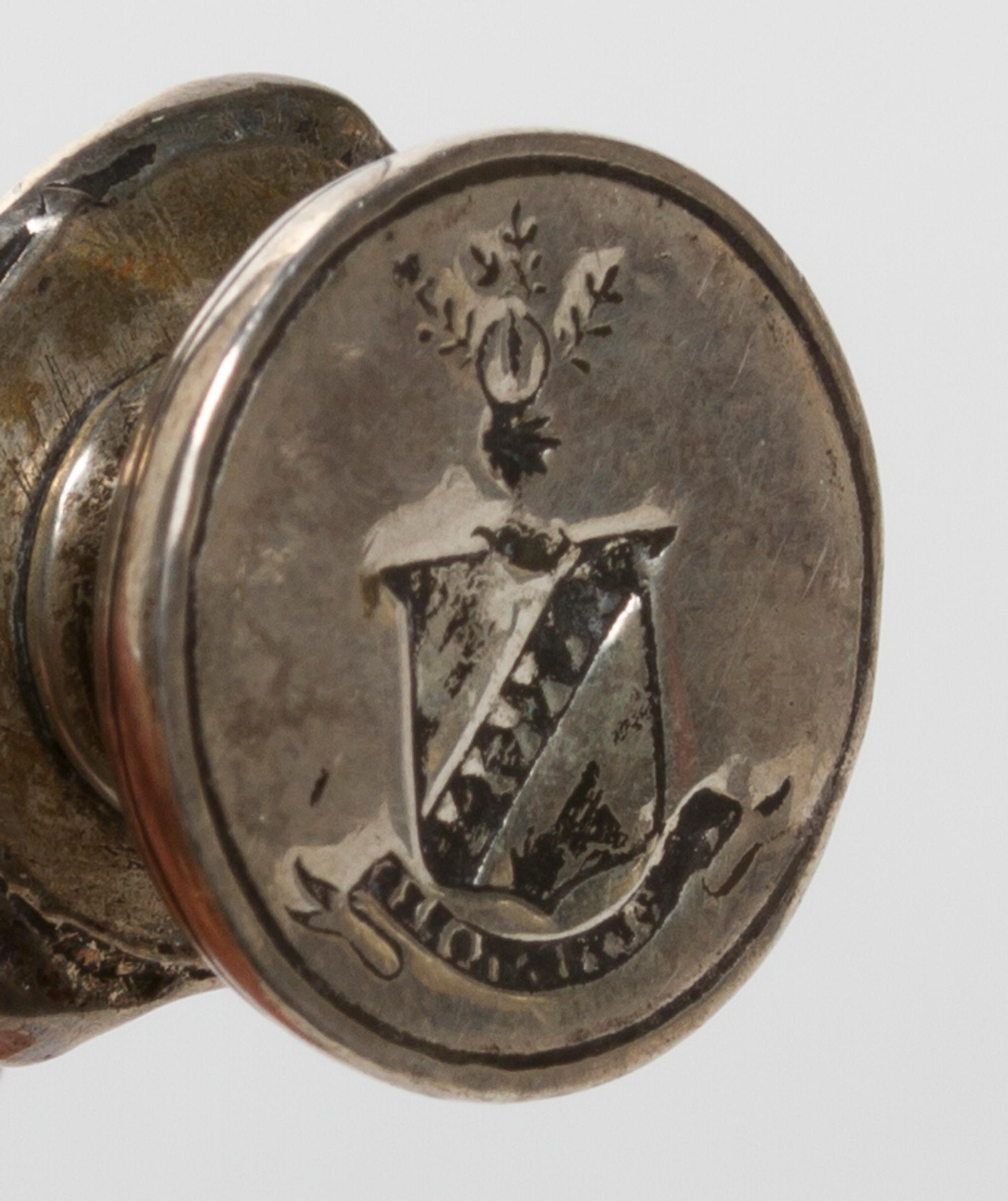 A Continental Silvered Metal Figural Seal, Height 3 1/4 inches.