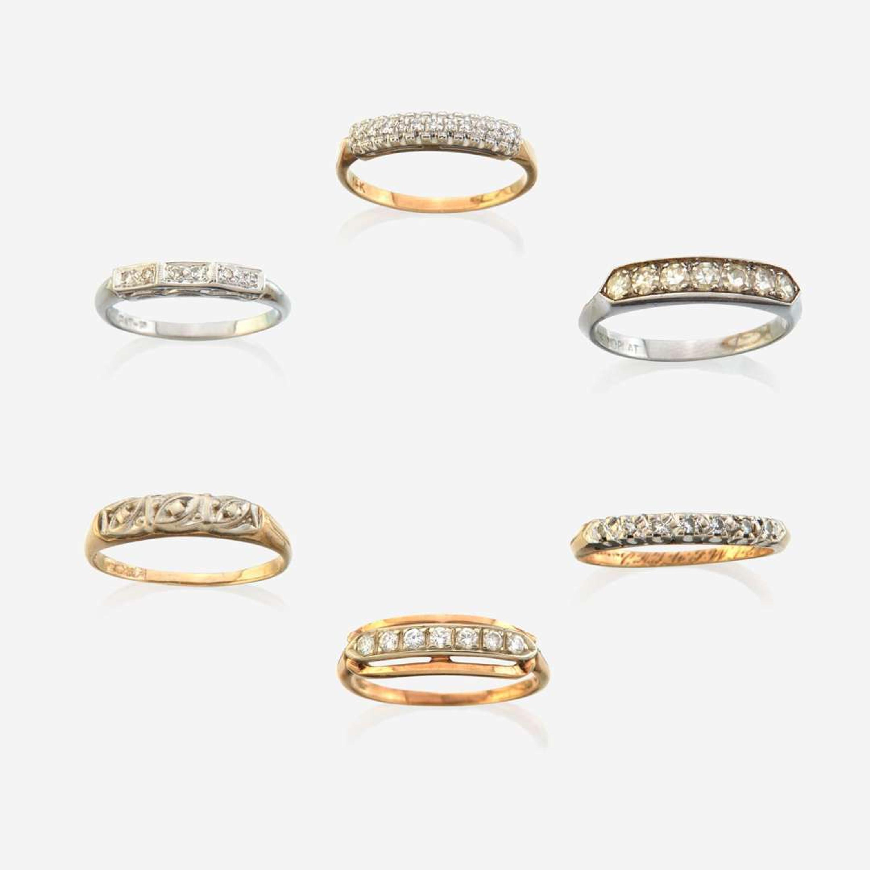 A collection of six gem-set rings
