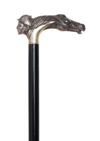 An American Sterling Silver Handled Cane, Length of handle 2 x length overall 31 1/2 inches.