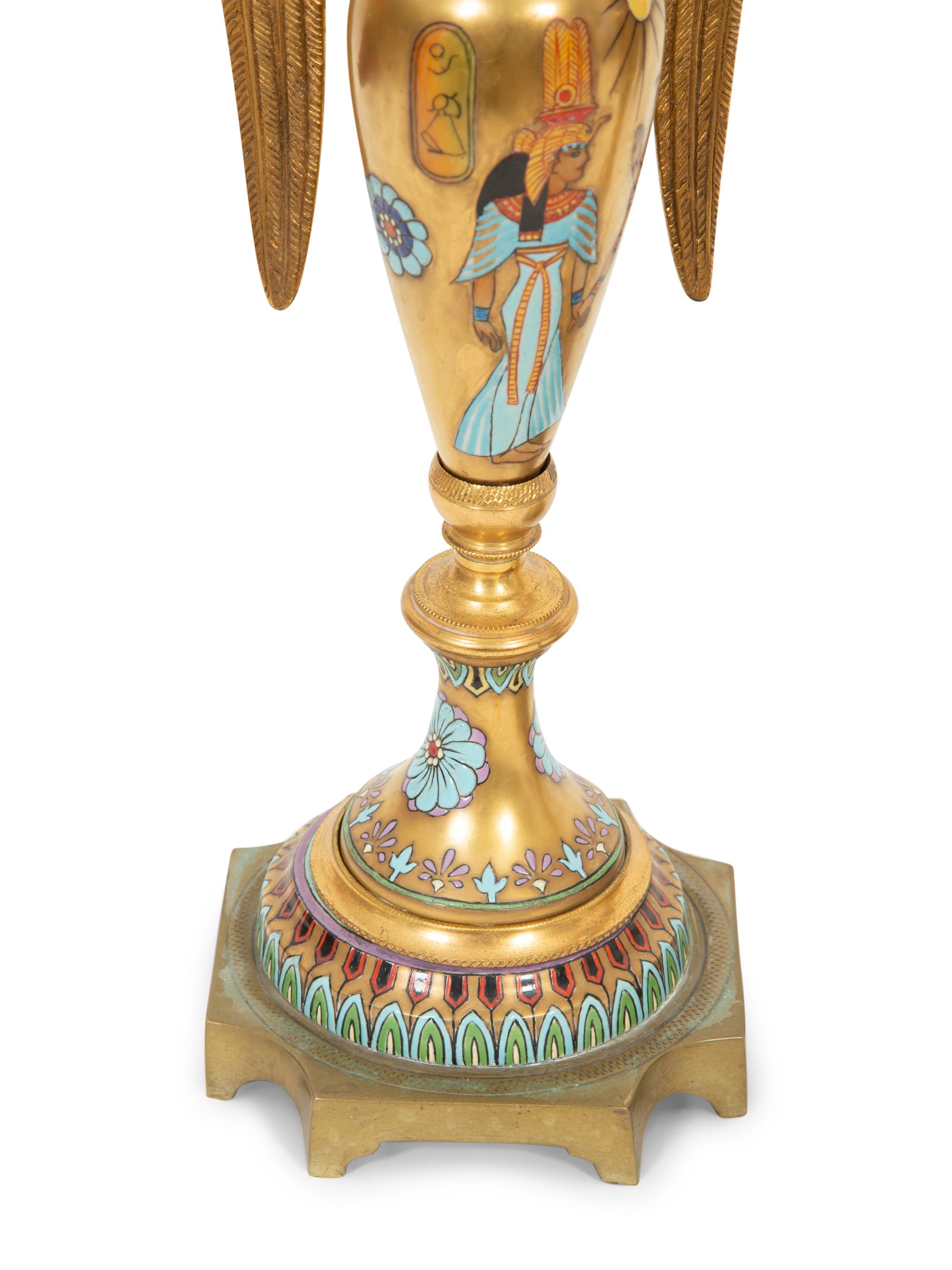A Pair of Continental Egyptian Revival Porcelain and Gilt Bronze Urn Ornaments
