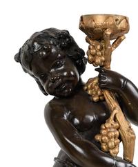 A Pair of Gilt and Patinated Metal Figural Torchères After Auguste Moreau