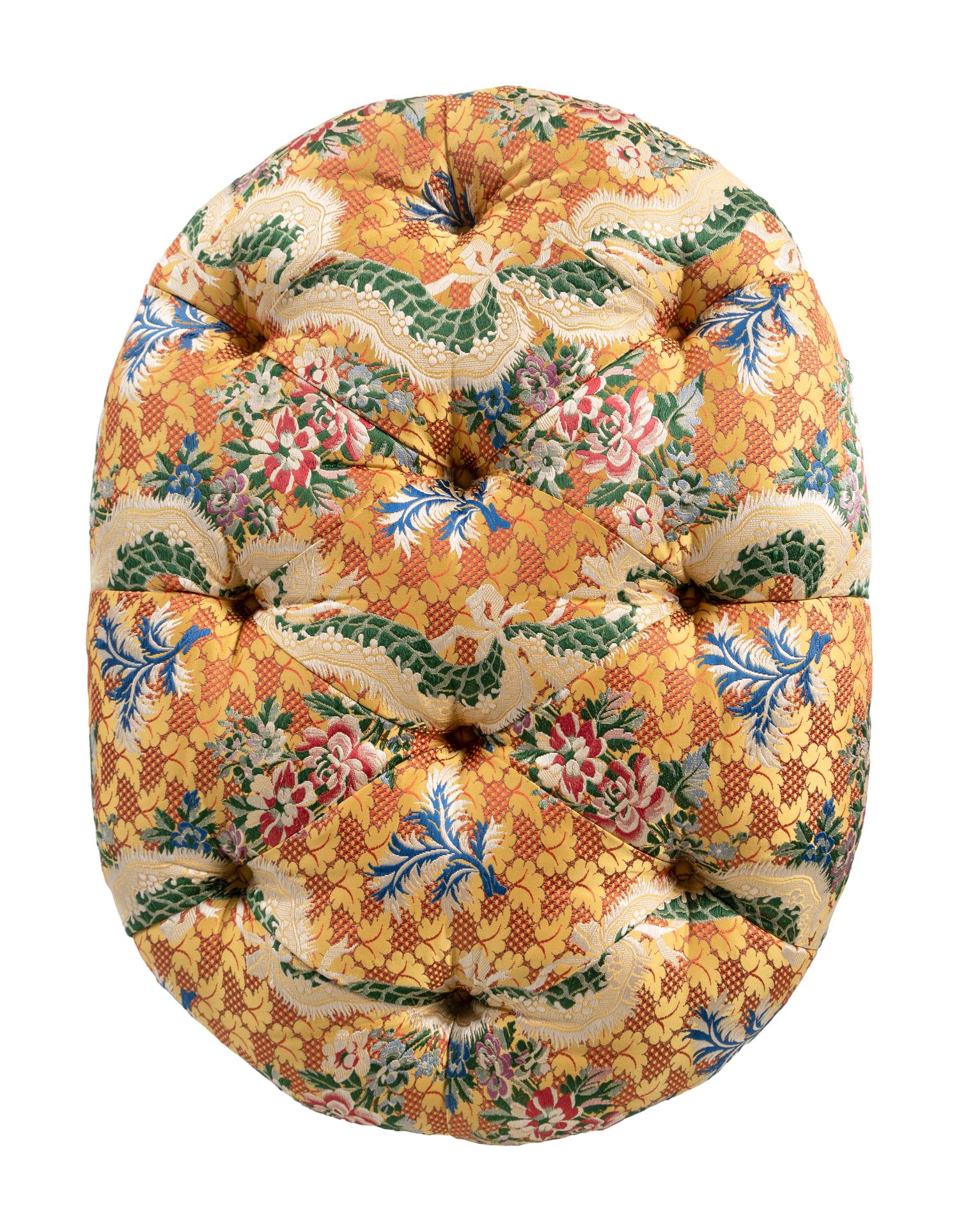 A Button-Tufted Ottoman with Jacquard Upholstery