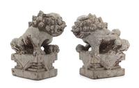 A Pair of Chinese Stone Figures of Buddhist Lions Height of each 10 3/4 inches. — 18TH CENTURY