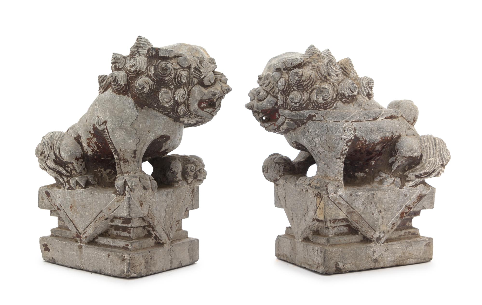 A Pair of Chinese Stone Figures of Buddhist Lions Height of each 10 3/4 inches. — 18TH CENTURY