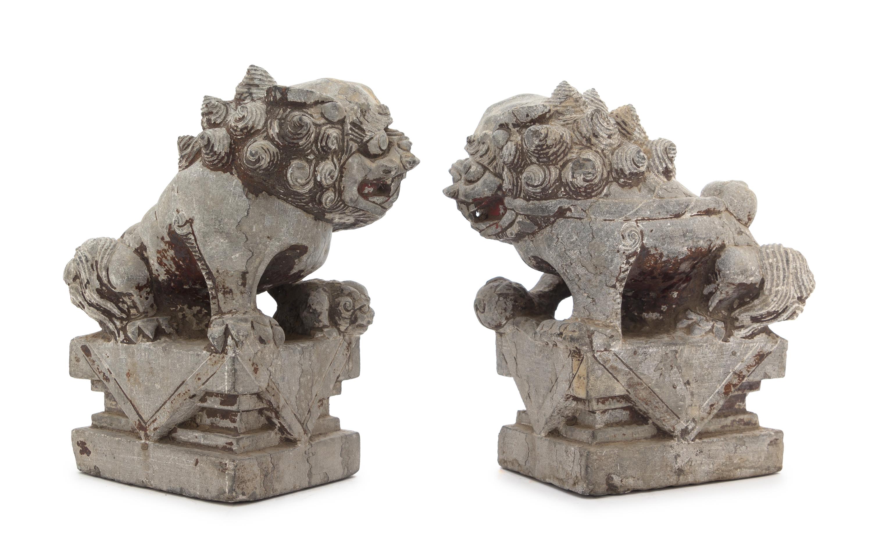 A Pair of Chinese Stone Figures of Buddhist Lions Height of each 10 3/4 inches. — 18TH CENTURY