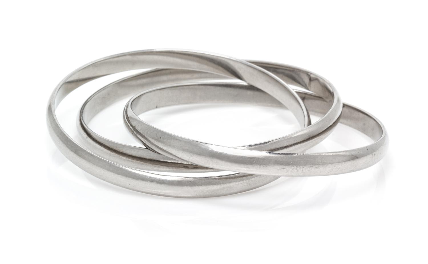 An Unusual Platinum Trinity Rolling Bangle Bracelet, Cartier, 84.10 dwts.