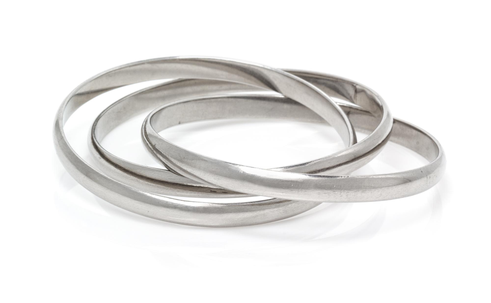 An Unusual Platinum Trinity Rolling Bangle Bracelet, Cartier, 84.10 dwts.