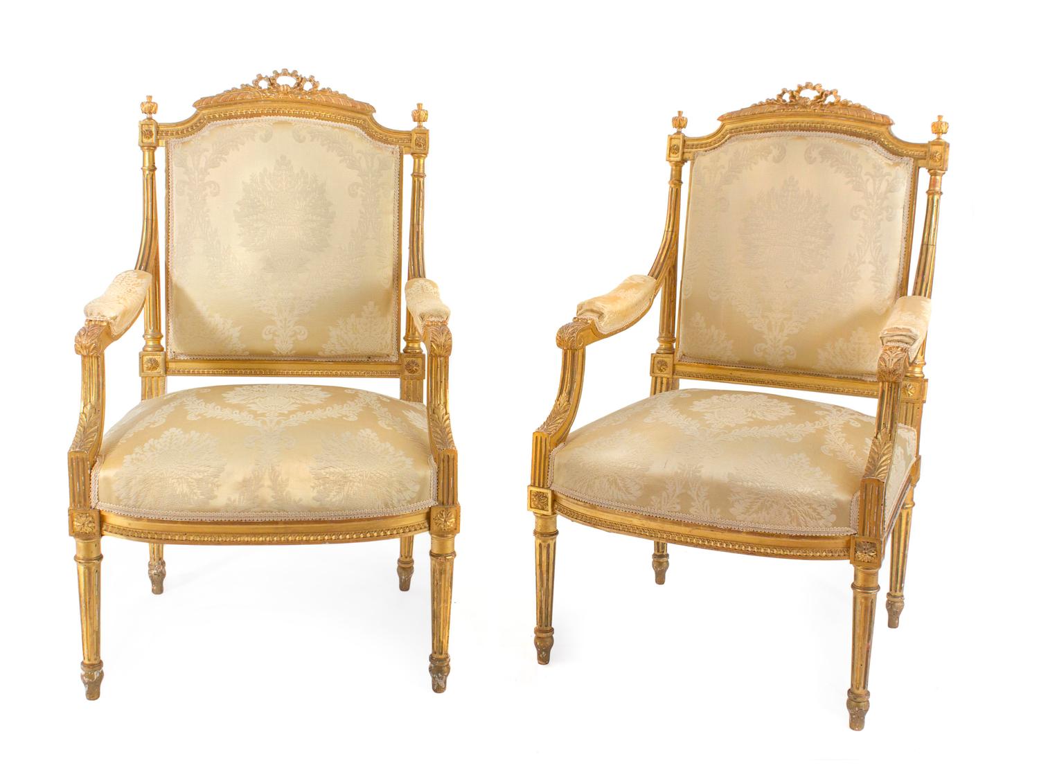 A Pair of Louis XVI Style Carved Giltwood Fauteuils — 19TH CENTURY