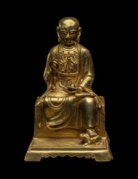 A Chinese Gilt Bronze Figure of a Seated Monk