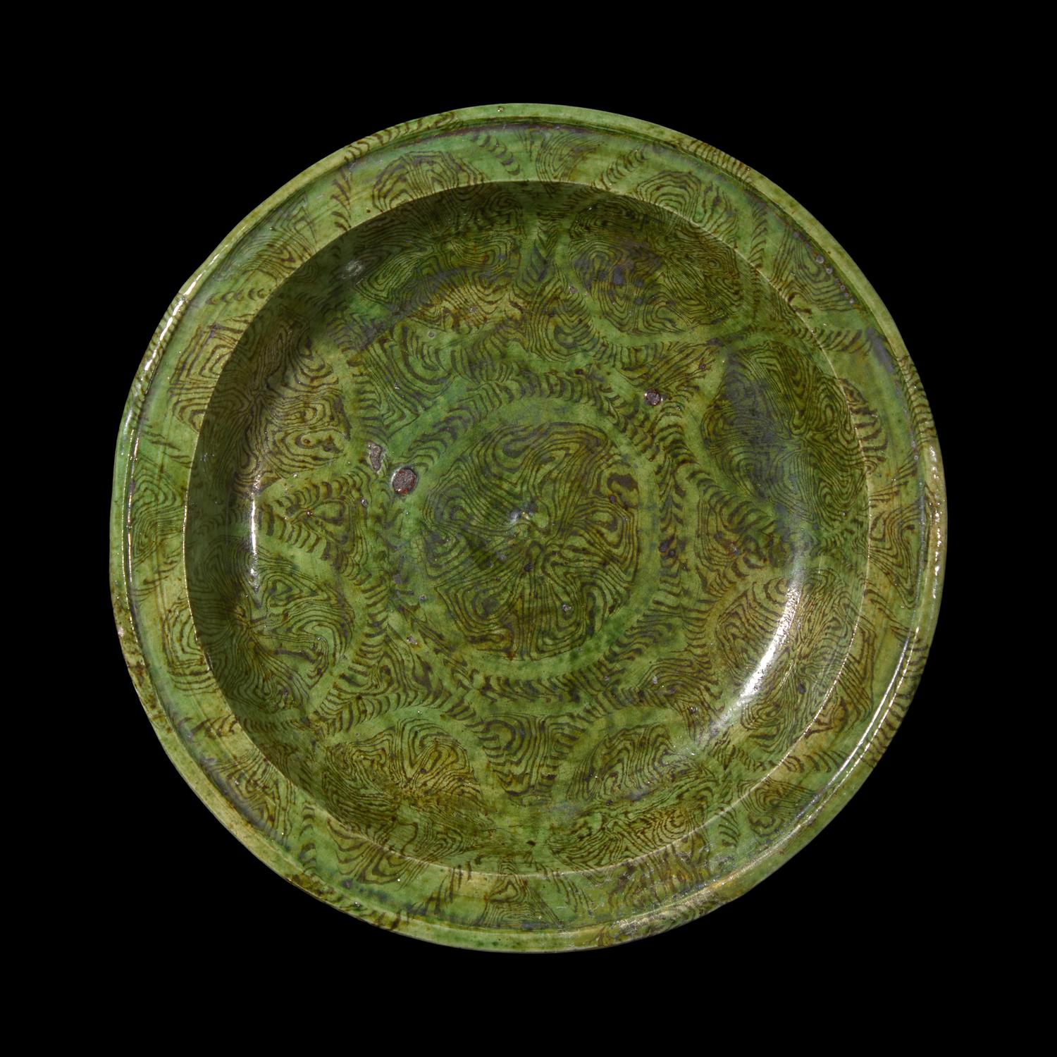 A Chinese Green Glazed Marbled Stem Dish, Possibly Tang Dynasty 或爲唐 綠釉絞胎高足盤