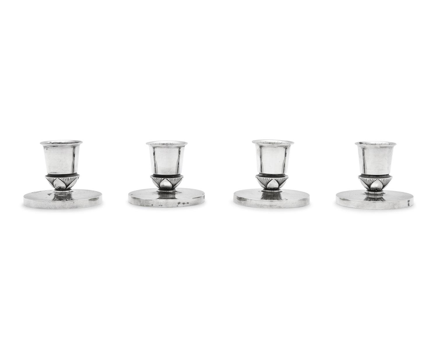 A Set of Four Gundorph Albertus Designed Georg Jensen Silver Cactus Pattern Candlesticks