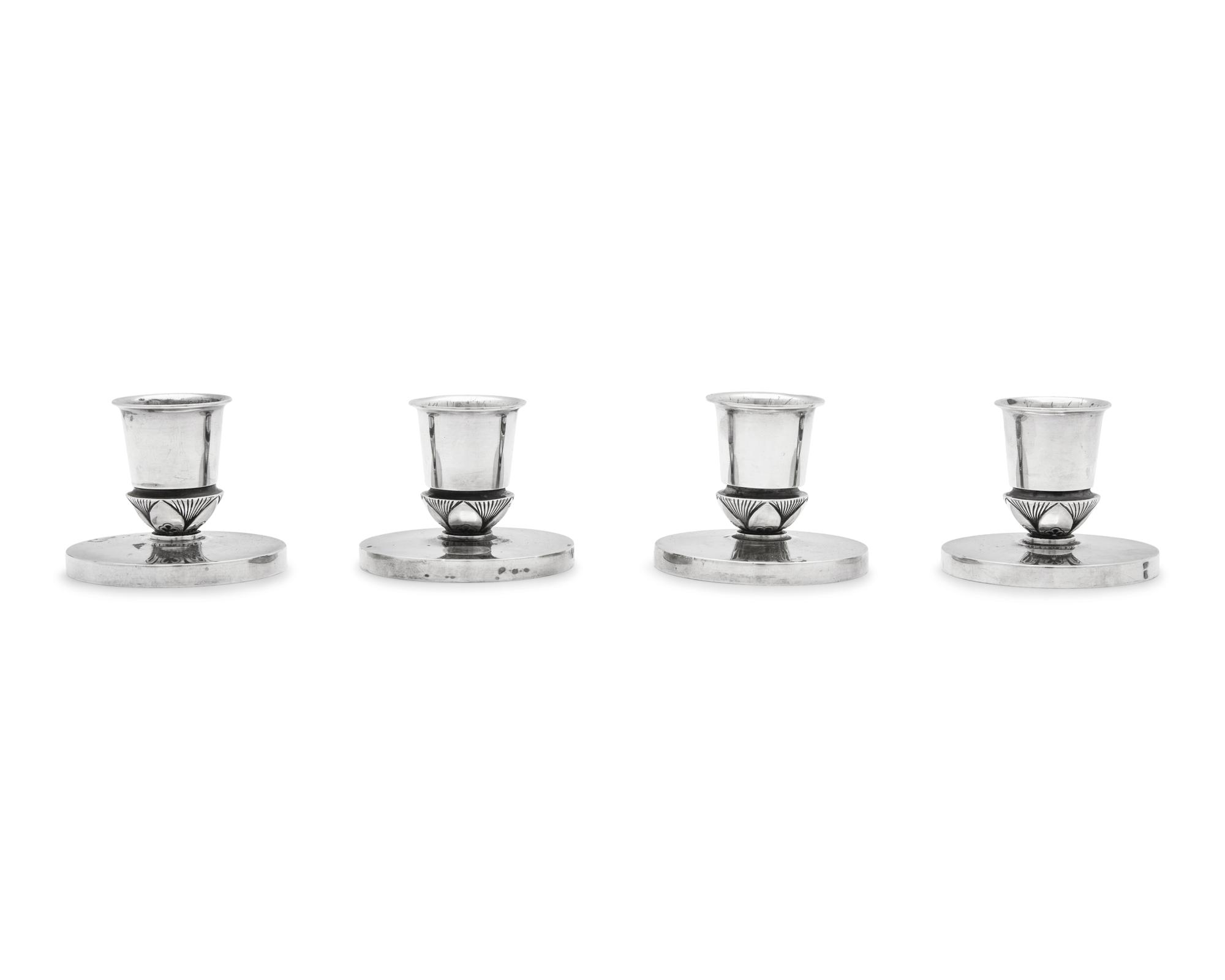 A Set of Four Gundorph Albertus Designed Georg Jensen Silver Cactus Pattern Candlesticks