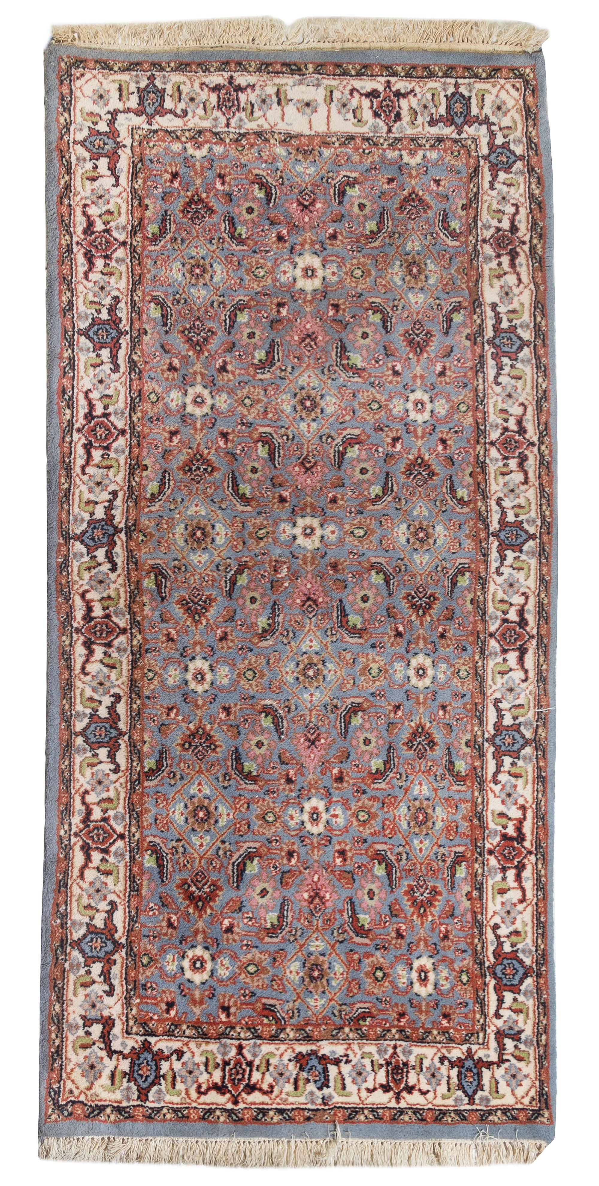 An Isfahan Wool Rug 6 feet 5 inches x 3 feet 2 inches.
