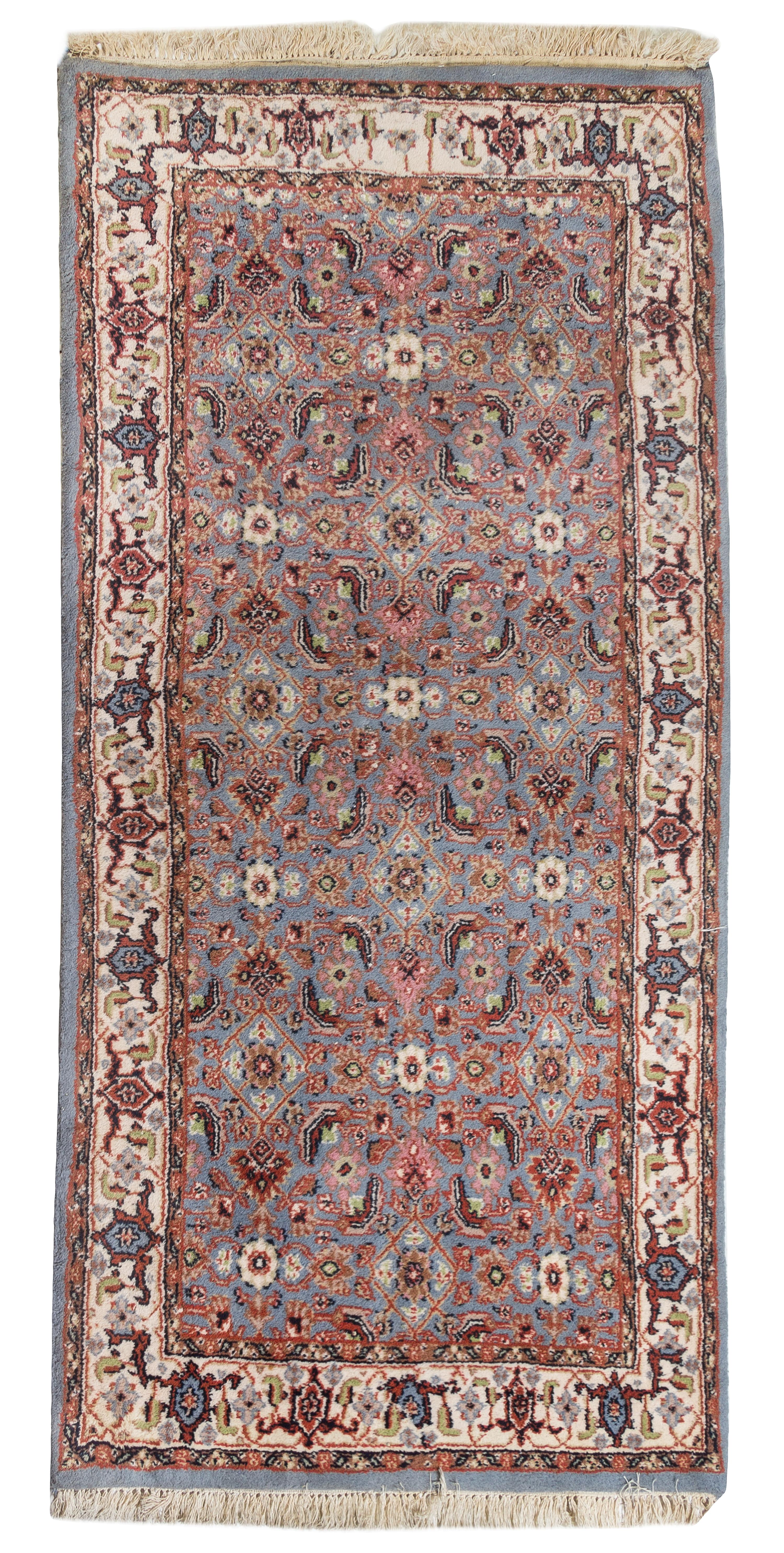 An Isfahan Wool Rug 6 feet 5 inches x 3 feet 2 inches.