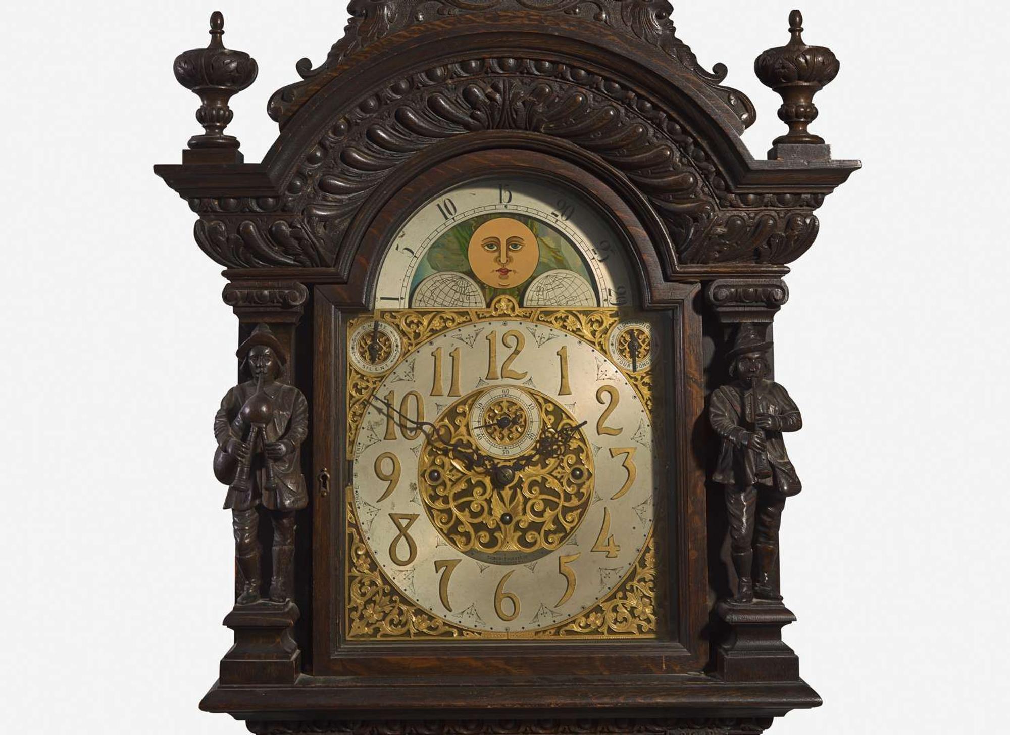An impressive Renaissance Revival carved oak tall case clock, the case attributed to R.J. Horner & Co., New York, NY, with works by Winterhalder & Hofmeier, Schwaerzenbach, Black Forest, Germany, retailed by Tilden Thurber Co., Providence, RI, late 19th / early 20th century