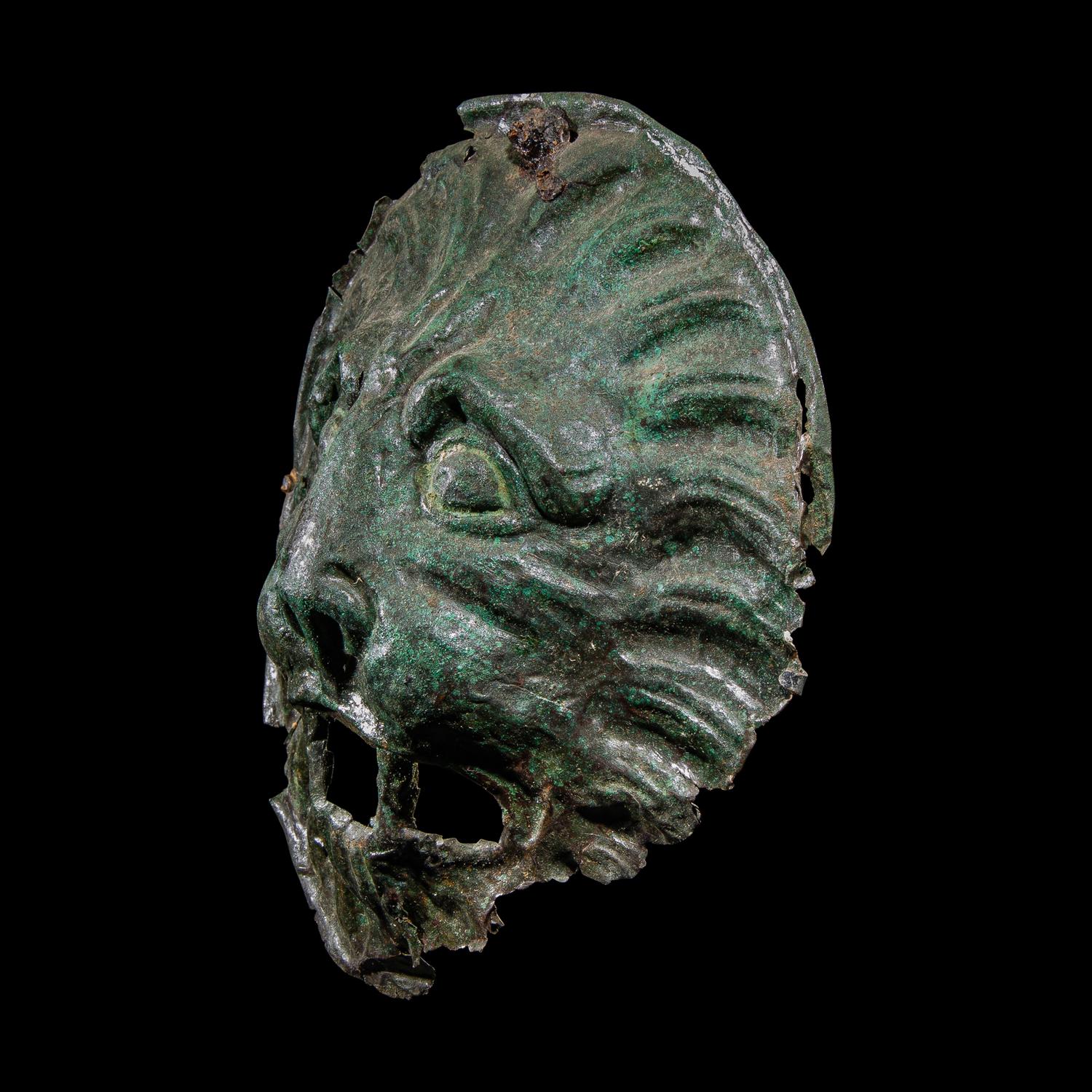 A Roman Bronze Sarcophagus Mask in the form of a Lion