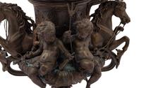 A Continental Cast Metal Urn with Putti and Hippocampi