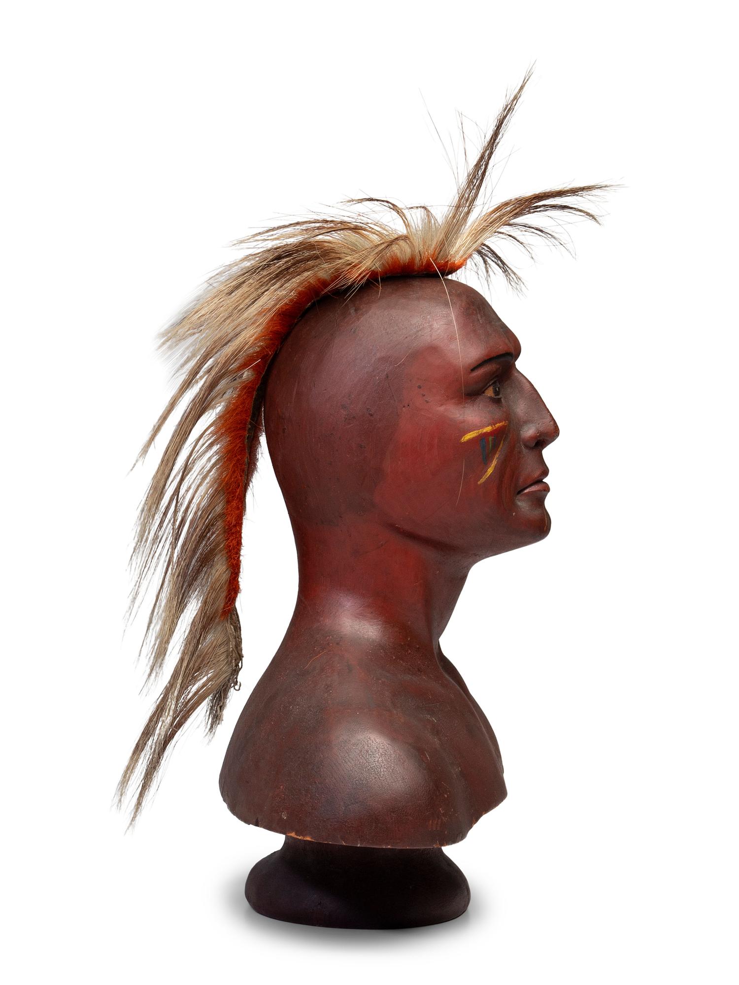 A Carved and Painted Pine Bust of a Native American