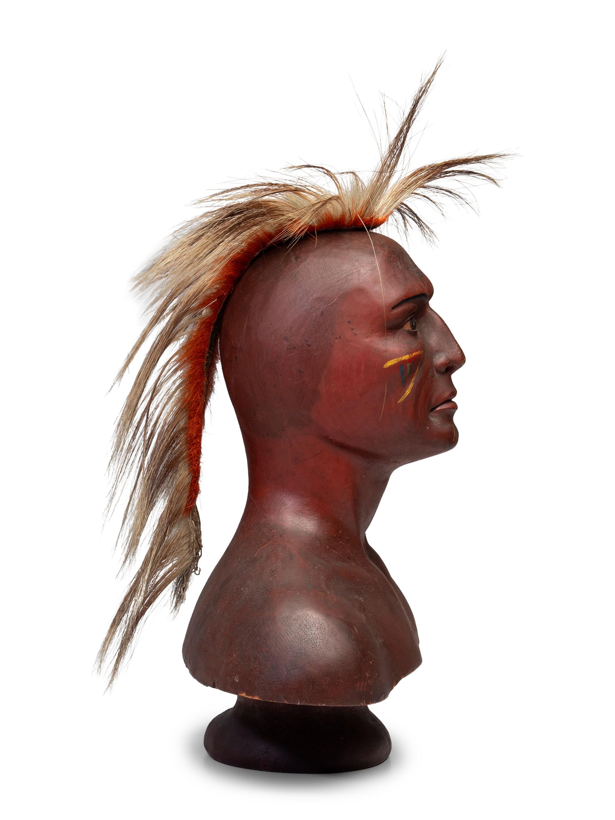 A Carved and Painted Pine Bust of a Native American