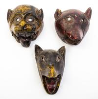 Three Tibetan or Nepalese Wood Masks Height of tallest 10 1/2 inches.