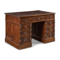A Renaissance Revival Carved Oak Pedestal Desk