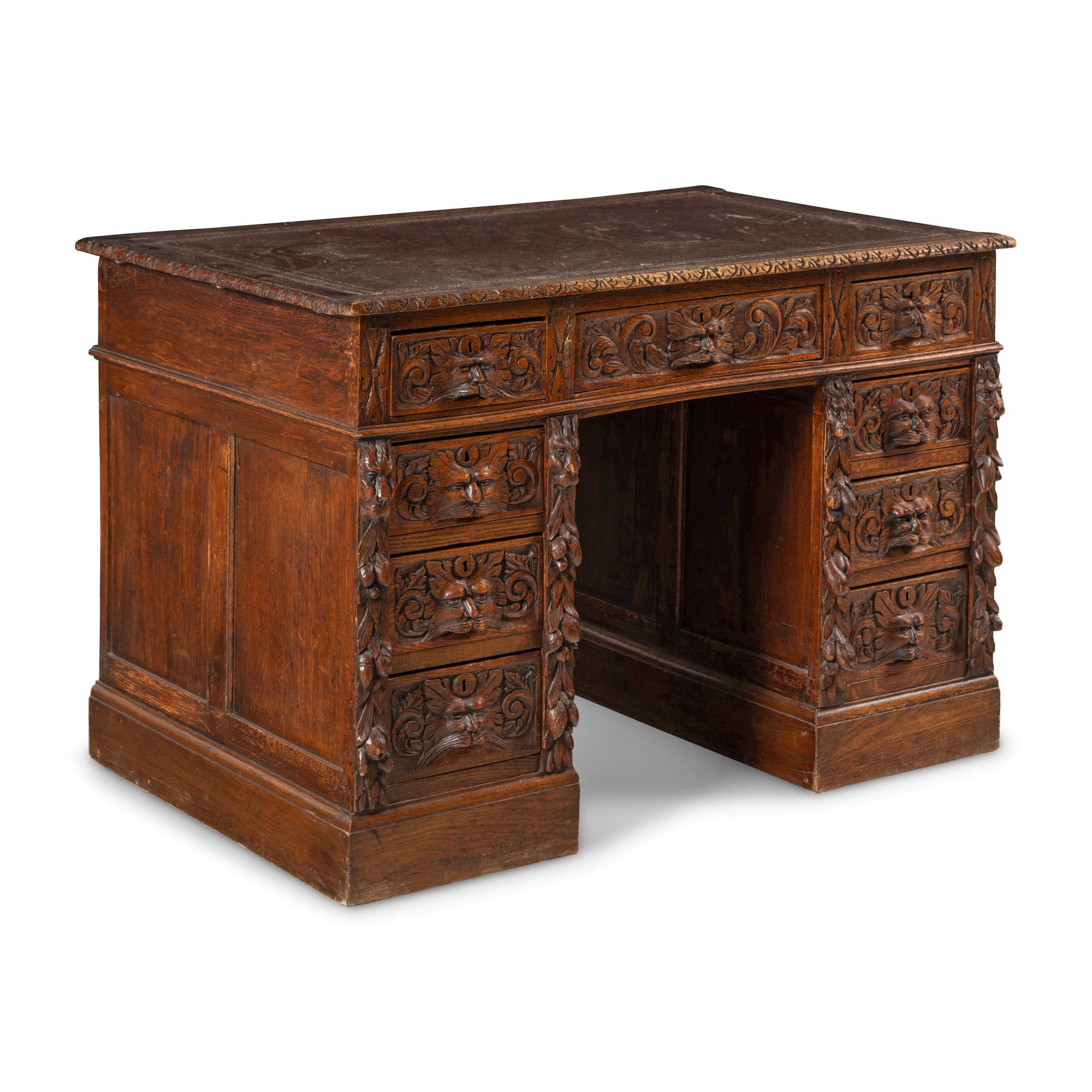 A Renaissance Revival Carved Oak Pedestal Desk