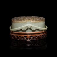 A Chinese Pale Celadon and Russet Jade Box and Cover, 20th Century 近代 青玉提梁式蓋盒