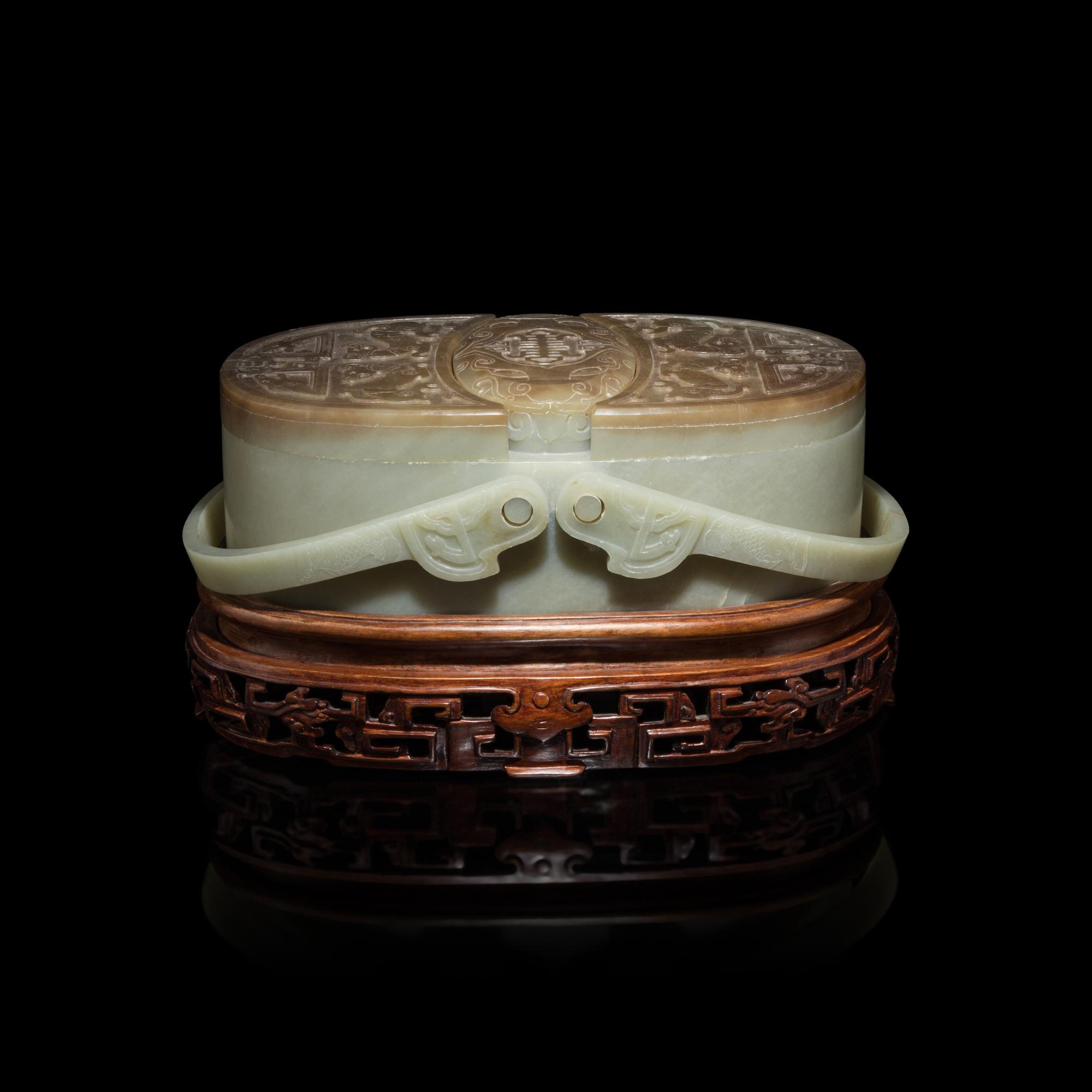 A Chinese Pale Celadon and Russet Jade Box and Cover, 20th Century 近代 青玉提梁式蓋盒