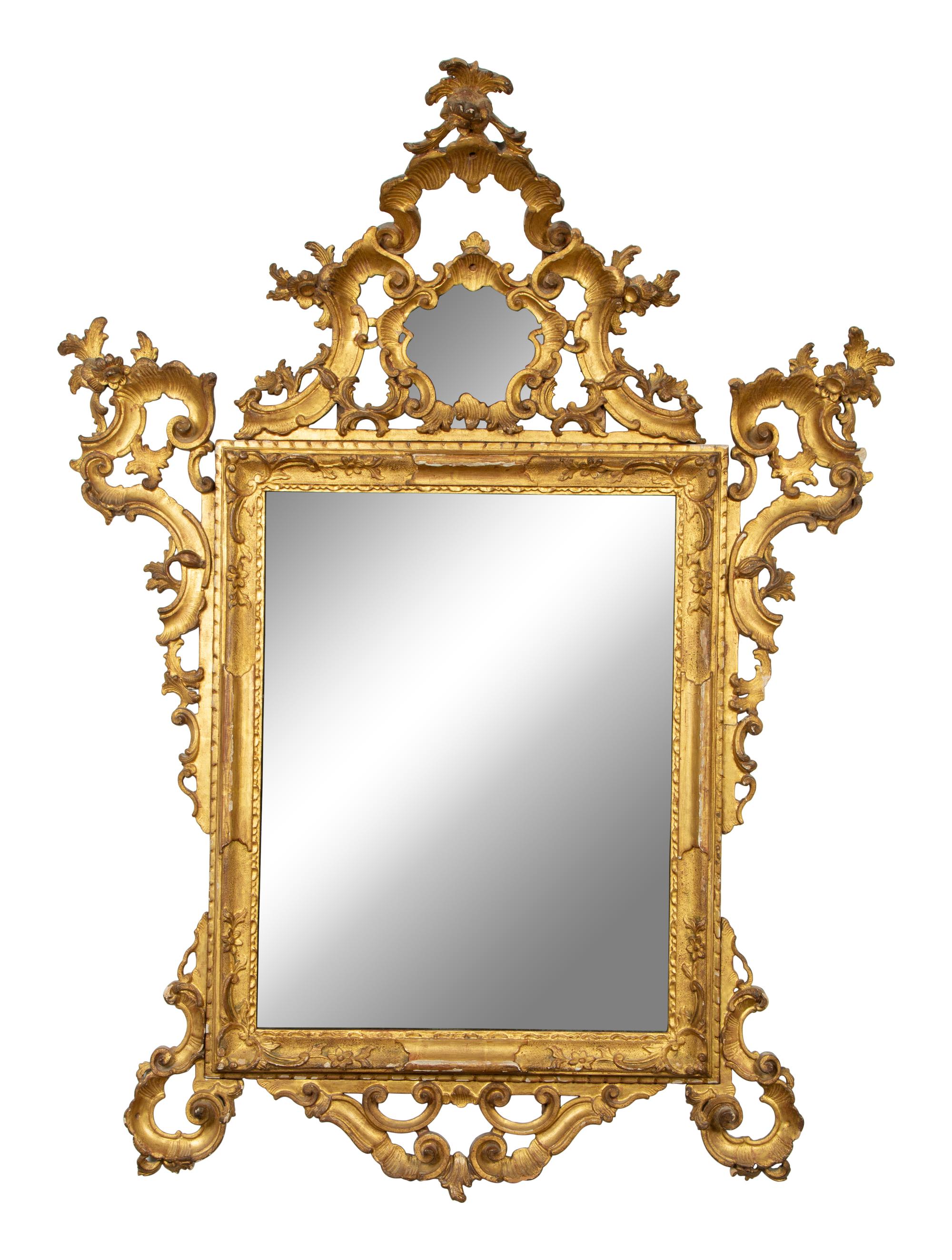 An Italian Rococo Carved Giltwood Mirror — 18TH CENTURY
