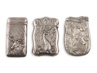 Three Silver Match Safes with Alligator, Peacock and Stag Motifs