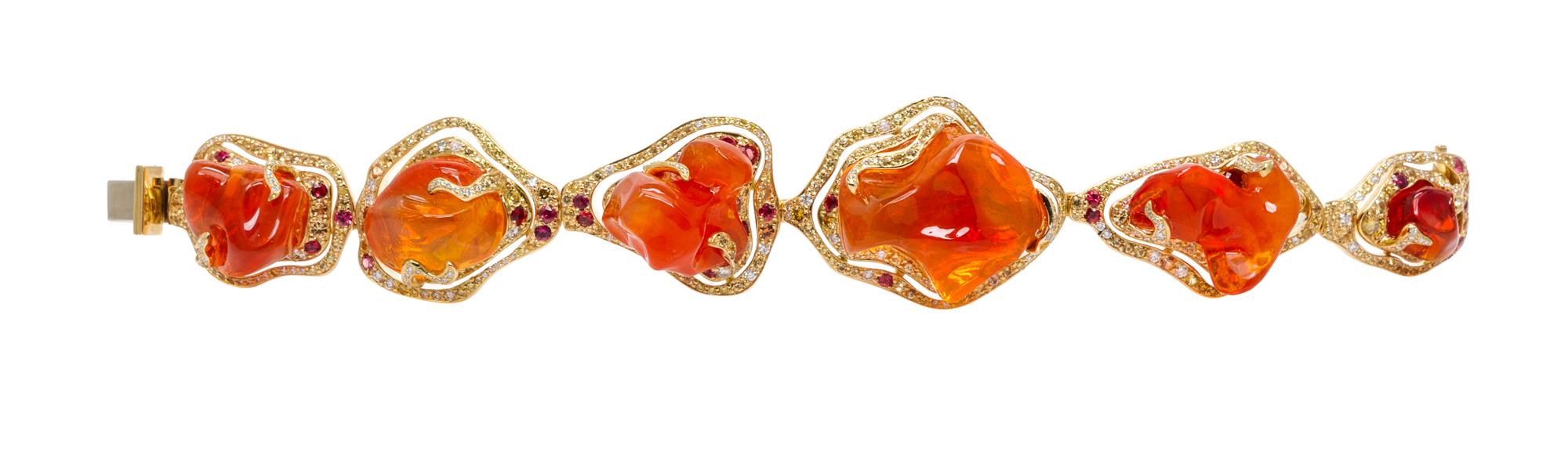 An 18 Karat Yellow Gold, Fire Opal, Colored Diamond, Diamond and Sapphire Bracelet, 52.20 dwts.