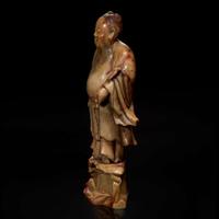 A Chinese carved beige soapstone figure of the Daoist immortal Zhongli Quan 壽山石雕鐘離權 Qing dynasty ?