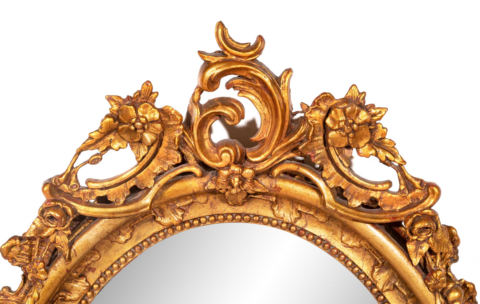 A Rococo Style Giltwood Mirror