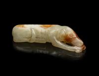 A Chinese Russet and Pale Celadon Green Jade Figure of a Hound