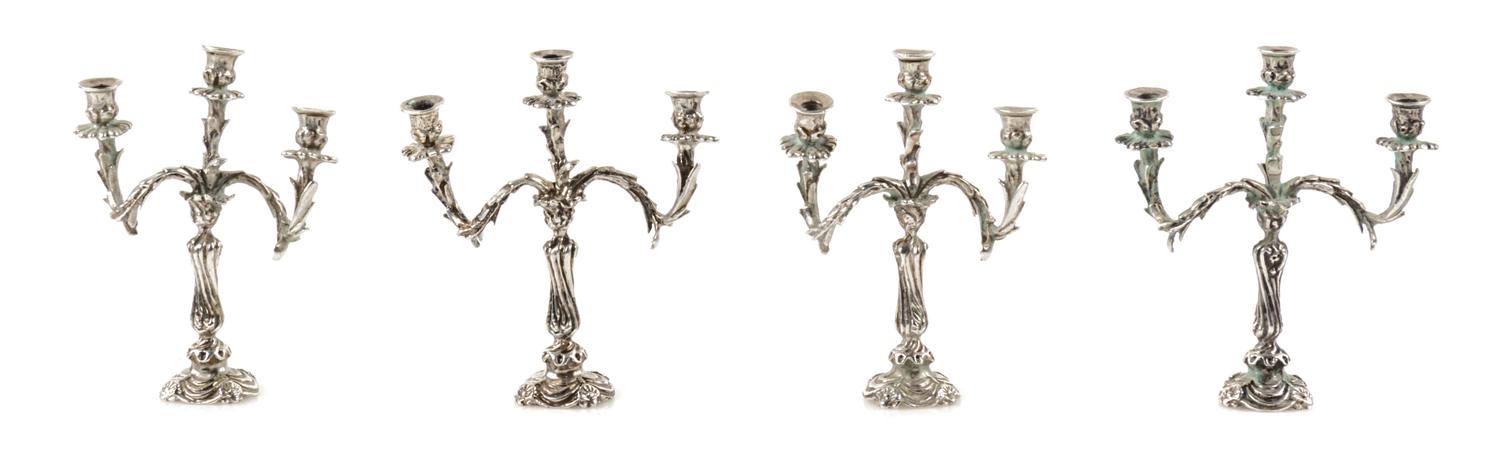 Four Silver Three-Light Candelabra, Harry Smith, Perrysville, IN, each having a baluster form standard issuing foliate candle arms.