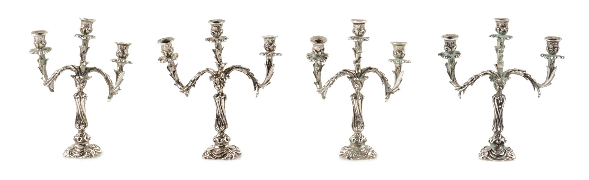 Four Silver Three-Light Candelabra, Harry Smith, Perrysville, IN, each having a baluster form standard issuing foliate candle arms.