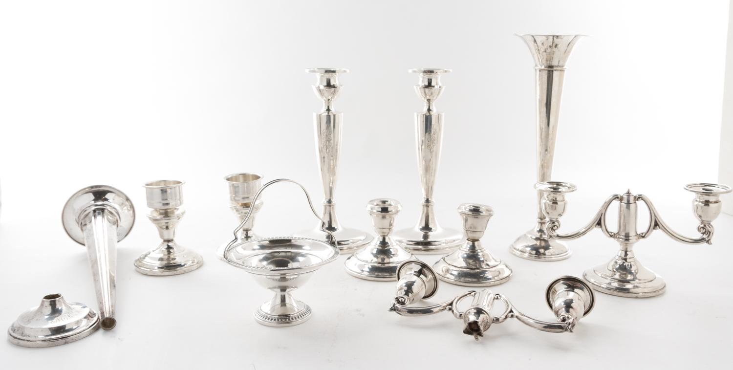 A Collection of American Silver Articles, of various makers, comprising six candlesticks, two trumpet vases and others, each weighted,