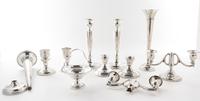 A Collection of American Silver Articles, of various makers, comprising six candlesticks, two trumpet vases and others, each weighted,