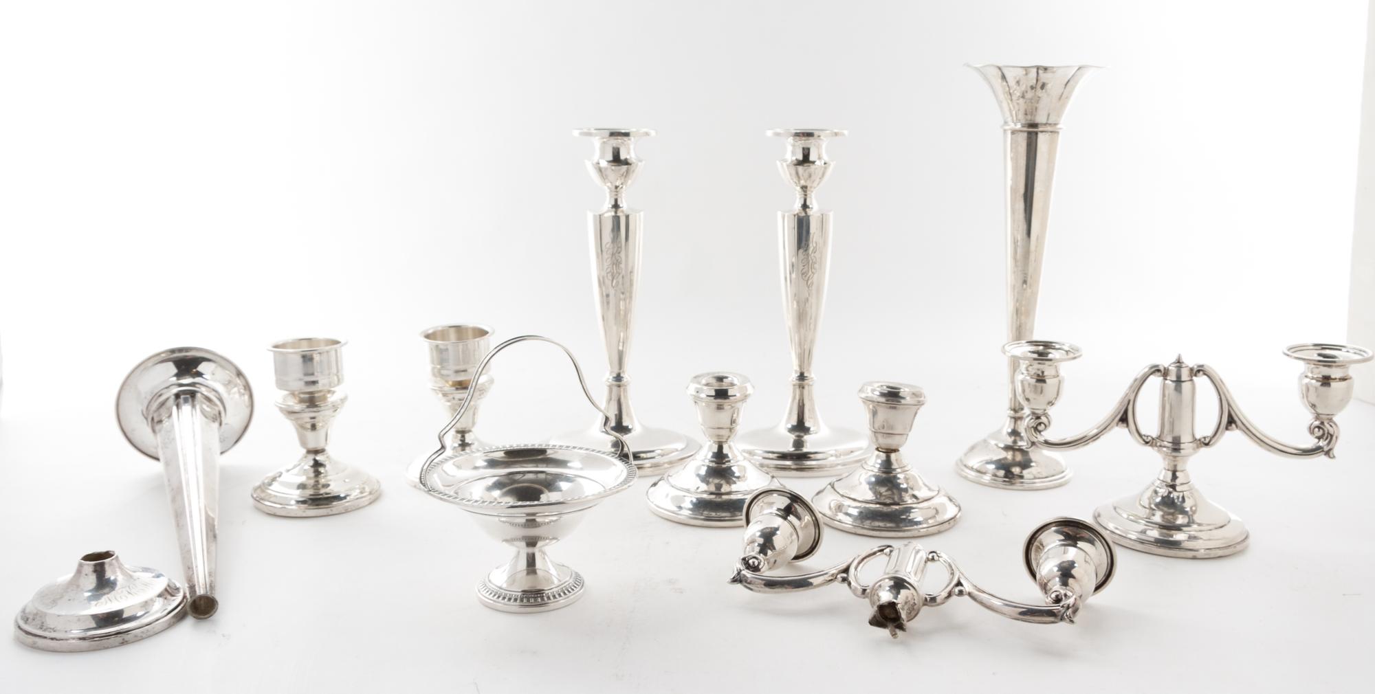 A Collection of American Silver Articles, of various makers, comprising six candlesticks, two trumpet vases and others, each weighted,