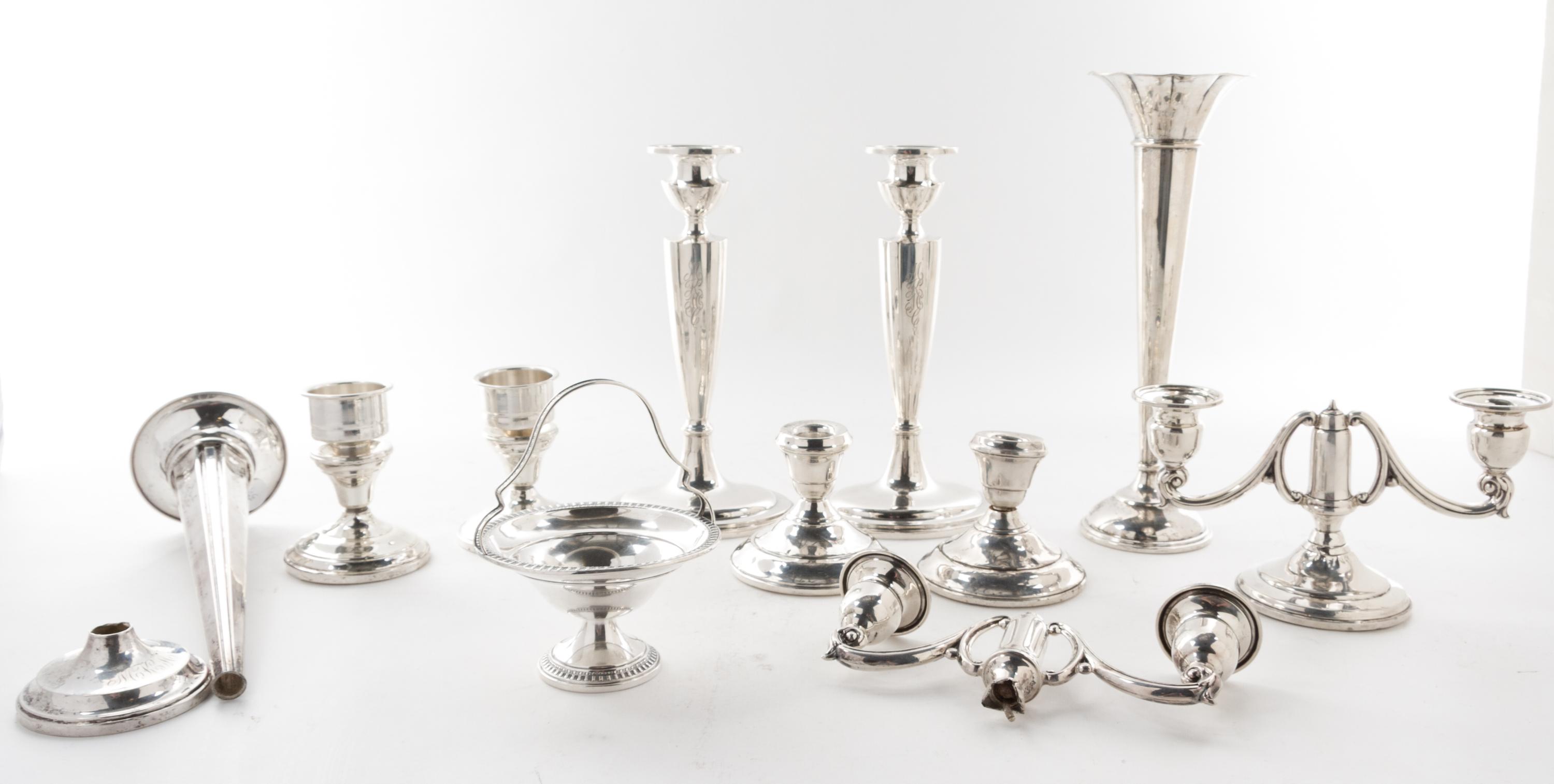 A Collection of American Silver Articles, of various makers, comprising six candlesticks, two trumpet vases and others, each weighted,