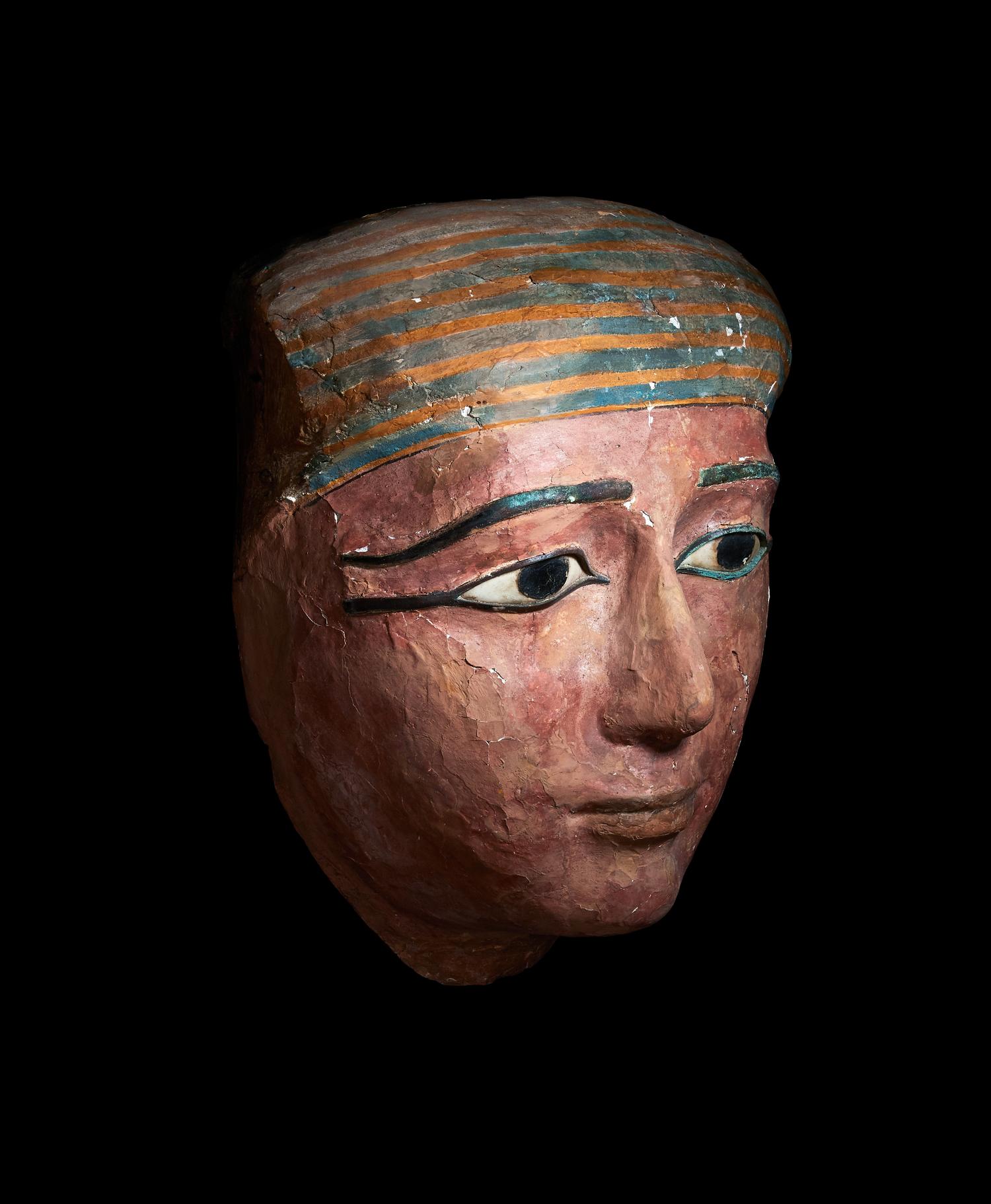 An Egyptian Polychrome Wood Mummy Mask with Bronze Inlays