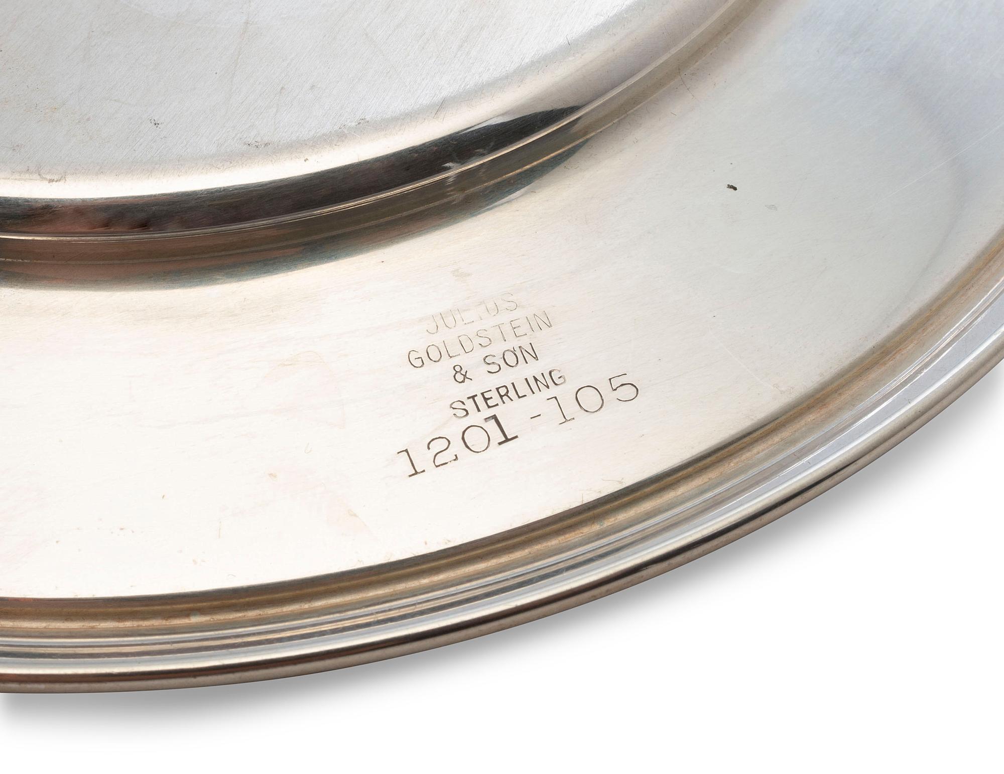 A Set of Seven American Silver Bread Plates