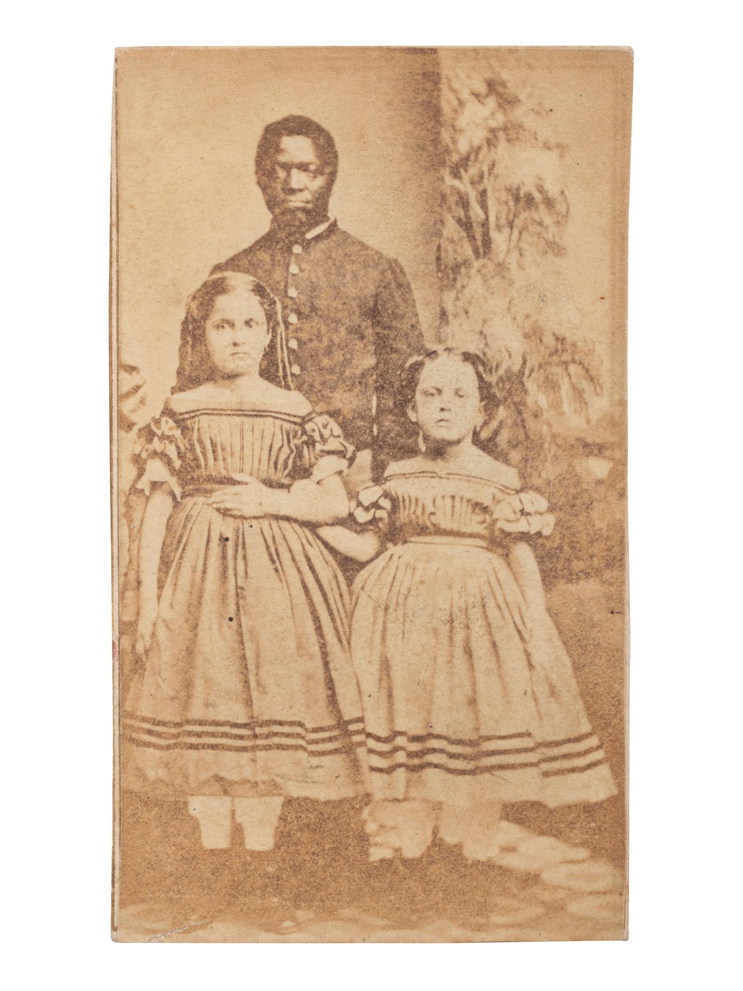 [SLAVERY & ABOLITION]. CDV of Robert Whitehead with white slave children Rebecca and Rosa of New Orleans. New London, CT: Morgan & Bolles, ca 1863-1864.
