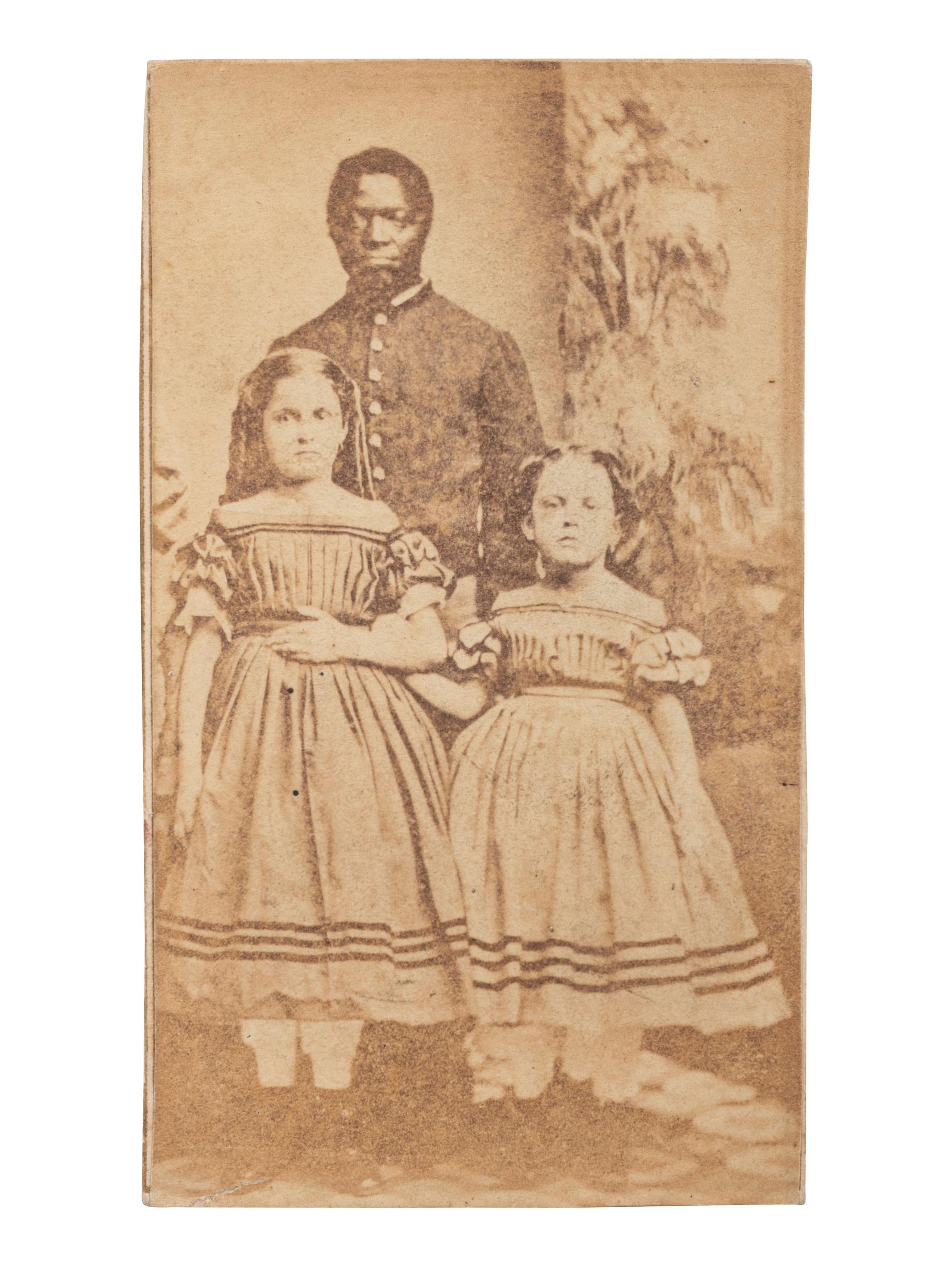 [SLAVERY & ABOLITION]. CDV of Robert Whitehead with white slave children Rebecca and Rosa of New Orleans. New London, CT: Morgan & Bolles, ca 1863-1864.