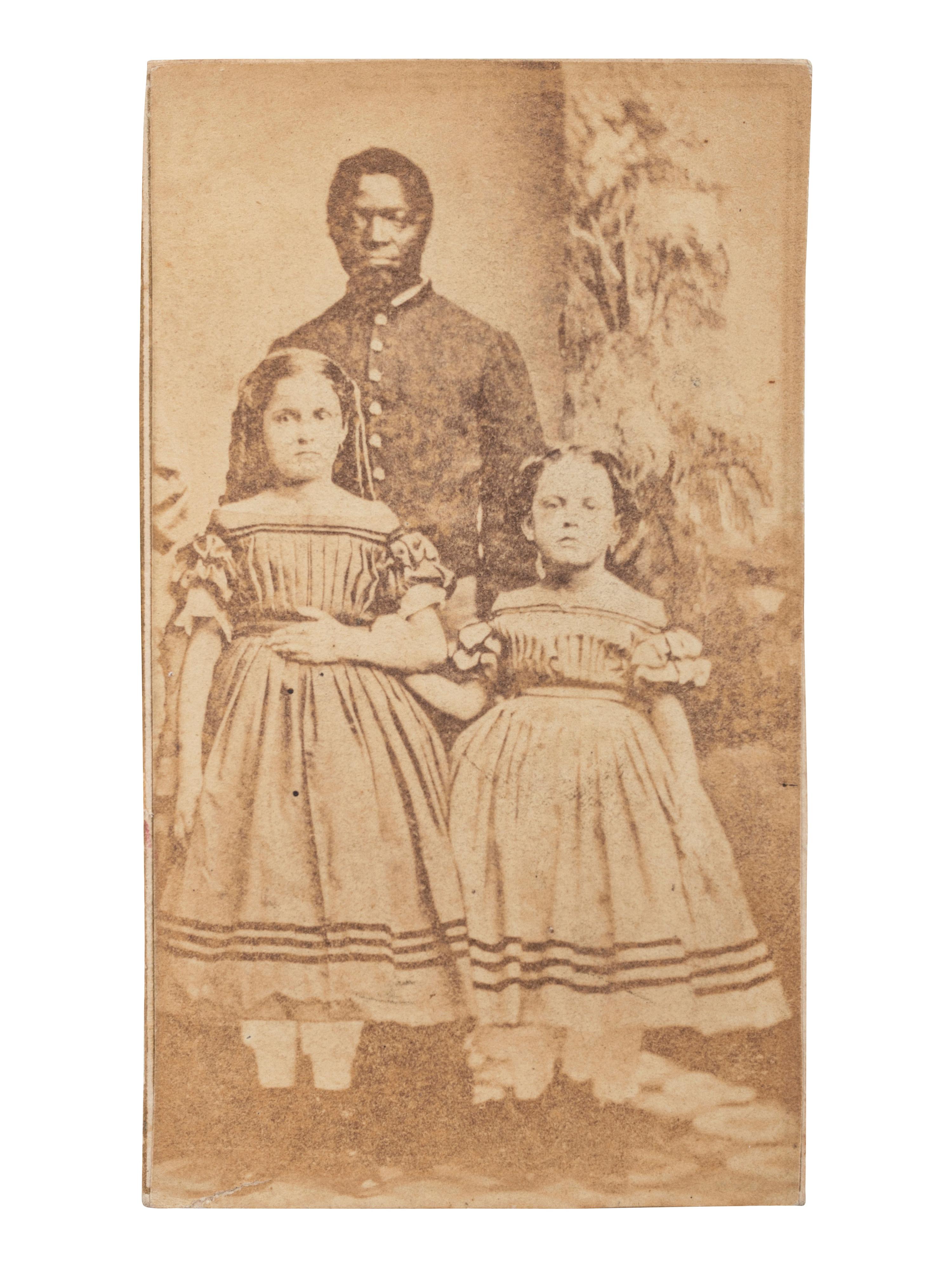 [SLAVERY & ABOLITION]. CDV of Robert Whitehead with white slave children Rebecca and Rosa of New Orleans. New London, CT: Morgan & Bolles, ca 1863-1864.