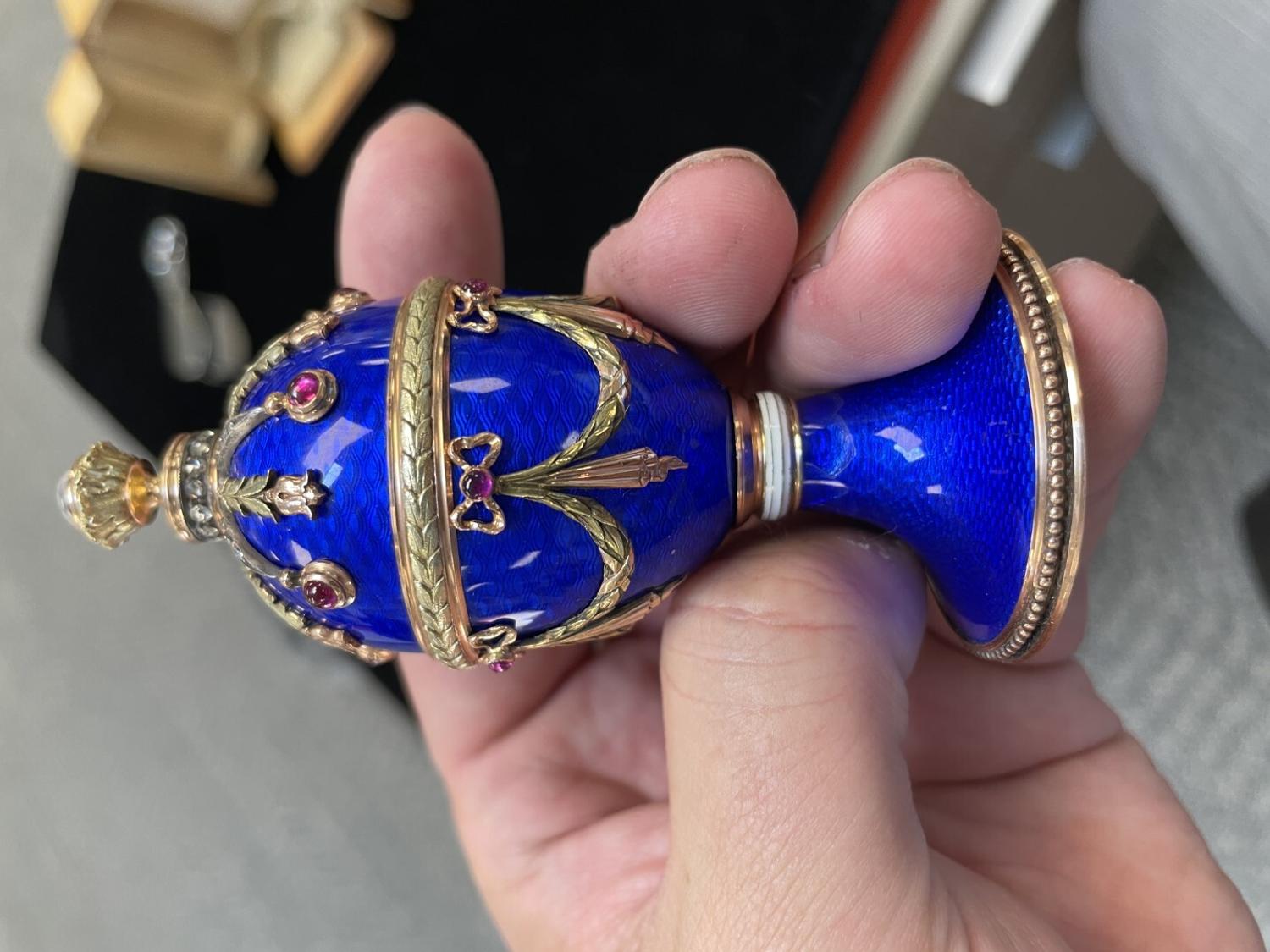 A 14 Karat Vari-Color Gold, Guilloché Enamel, Diamond, and Cabochon Jewel-Mounted Egg-Form Perfume and a Related Guilloché Enamel, 14 Karat Vari-Color Gold, Diamond, and Cabochon-Mounted Surprise Egg