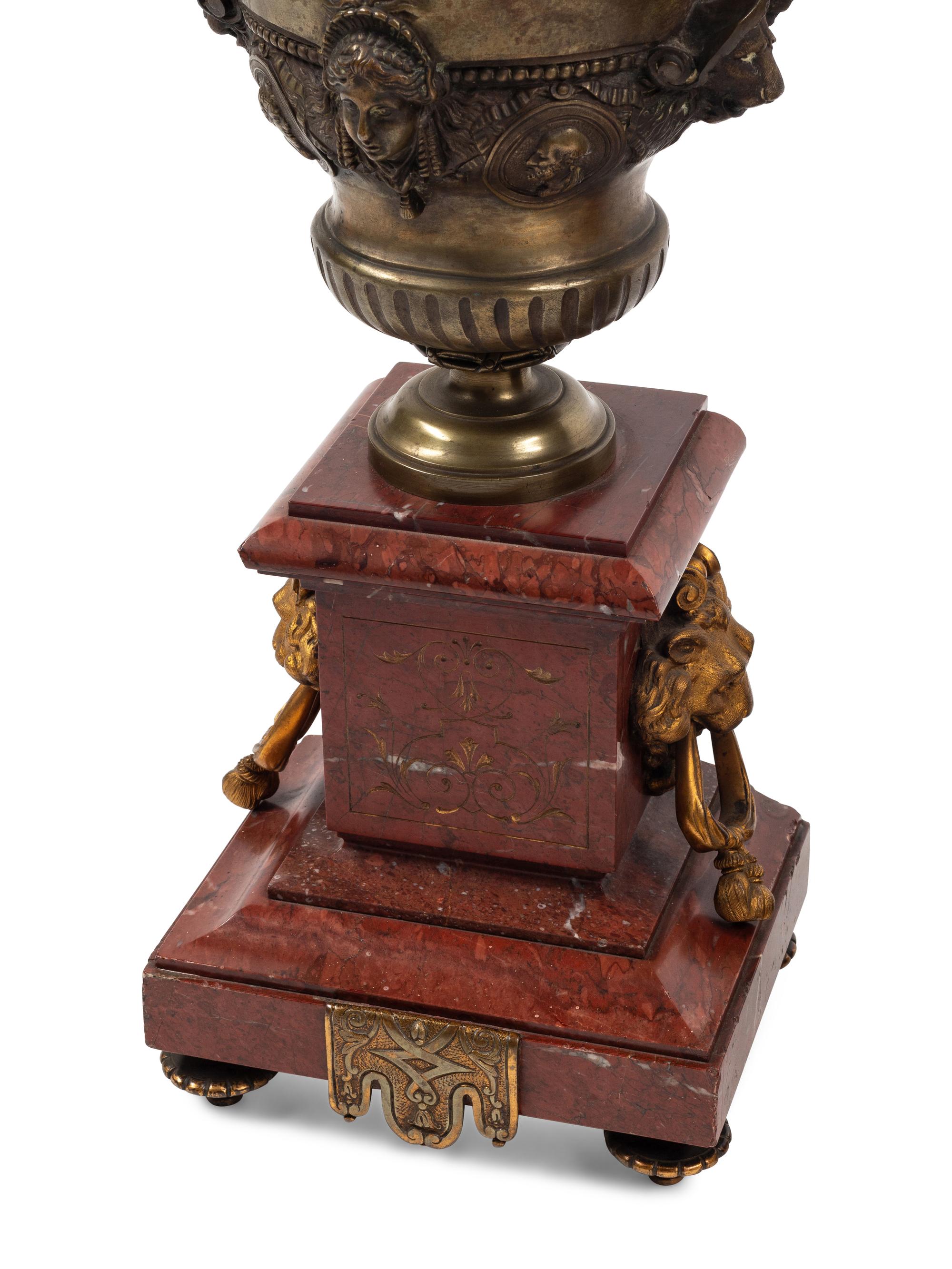 A Monumental French Neoclassical Gilt Bronze and Rouge Marble Clock Garniture