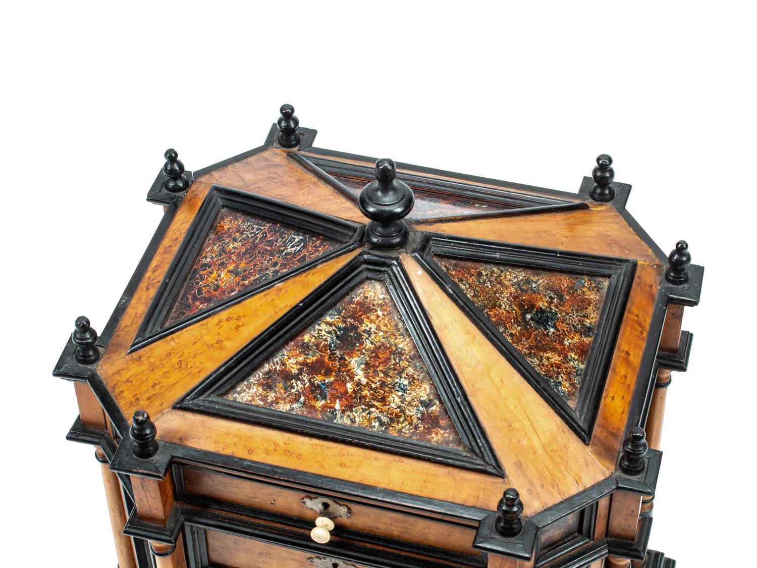 A Continental Birdseye Maple, Ebonized Wood and Painted Foil Table Cabinet