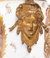 A Pair of Gilt Bronze Mounted Sèvres Style Porcelain Urns Mounted as Lamps